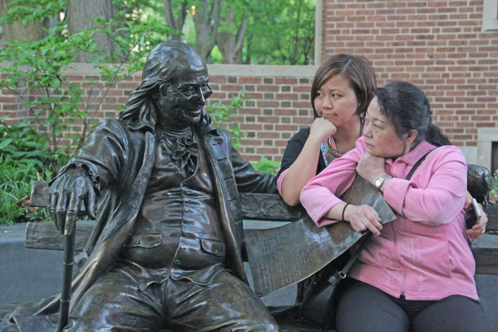 Lor and her mother pose with Ben Franklin in 2016, when Lor graduated from Penn GSE. While initially worried about her daughter living away from home, Lor’s mother was later impressed. “I’m not concerned about you,” Lor’s mother told her after visiting. “You know how to find food and survive.”